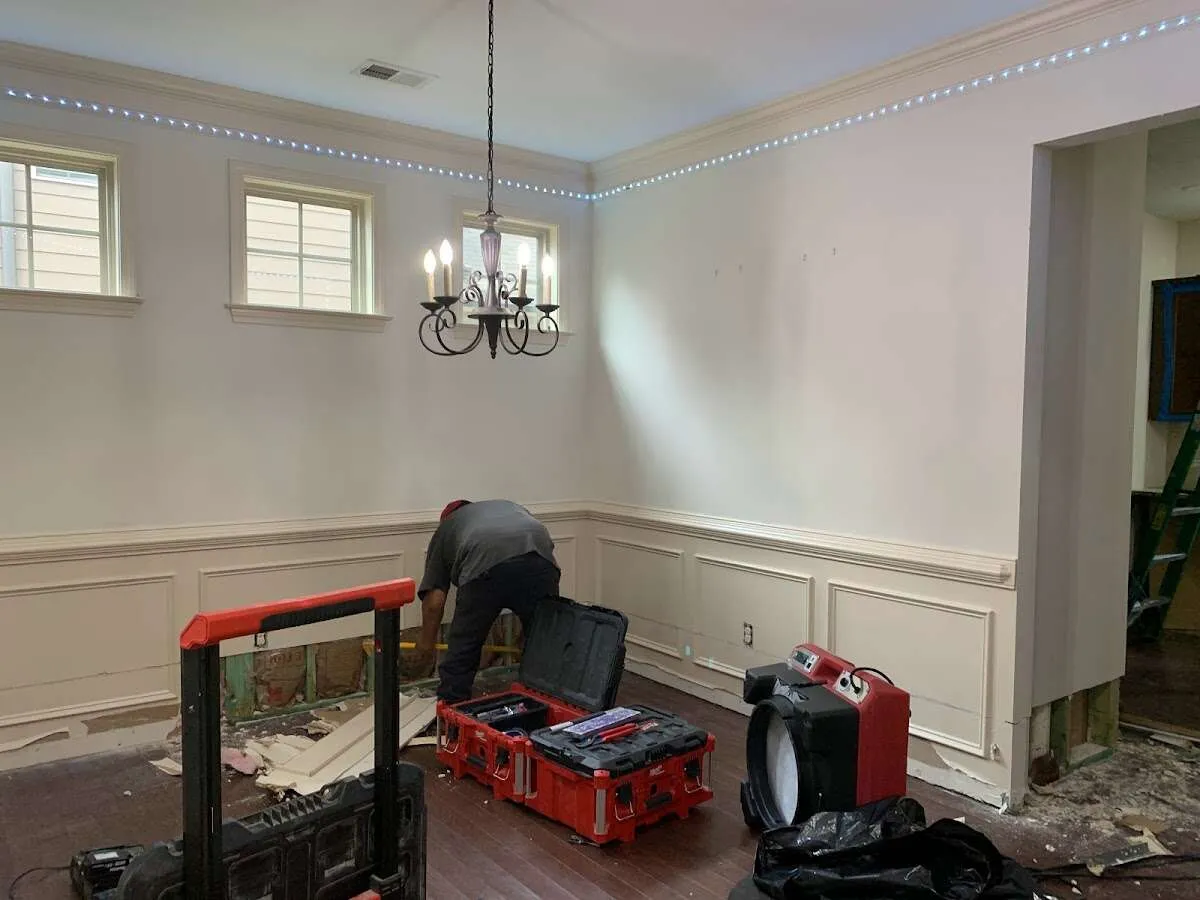 Restoration technician with professional equipment in Greenville